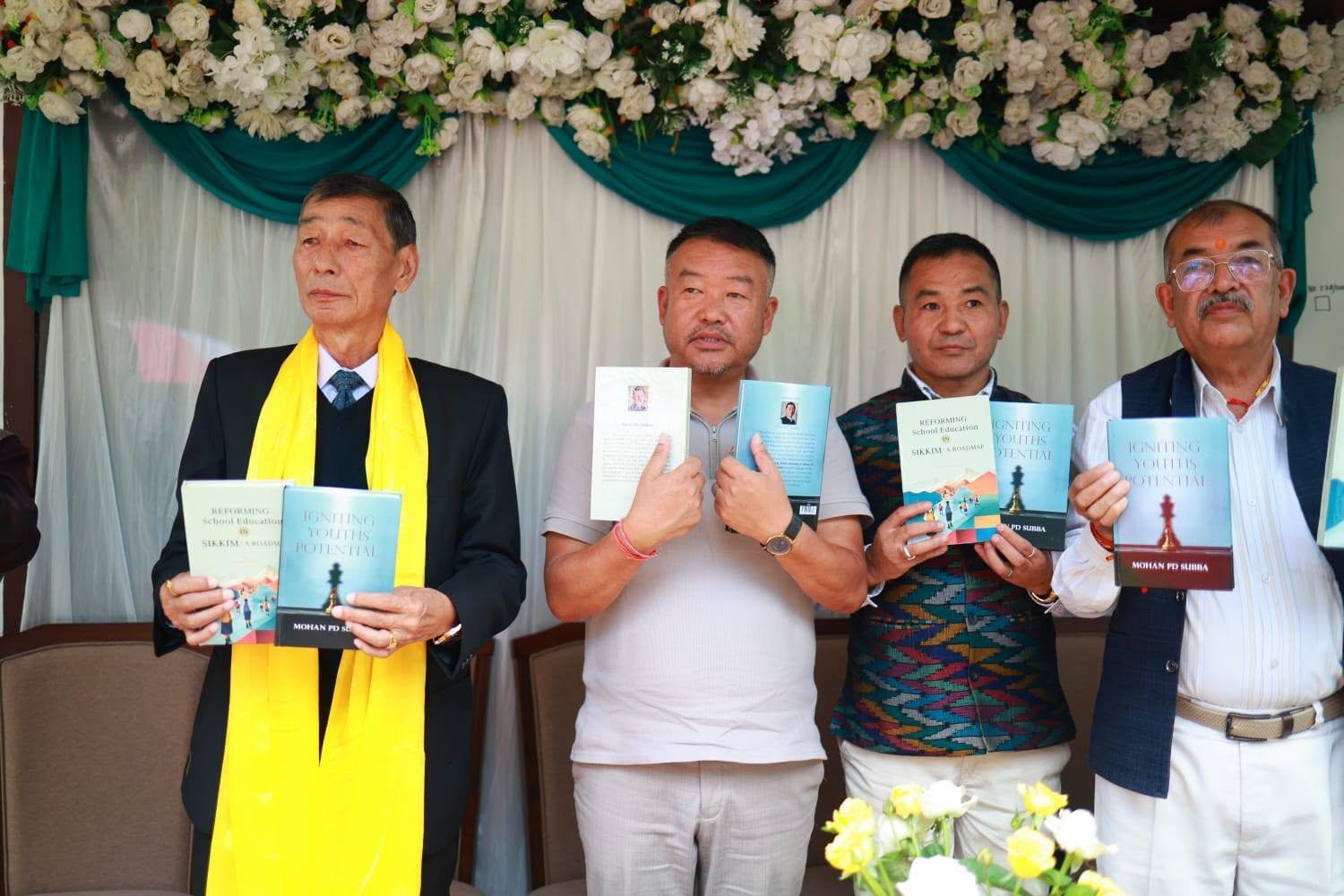 Dignitaries hold copies of the two newly released books at Ambali Heem, Hee Gaon, Gyalshing District